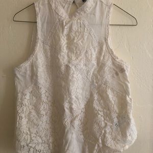 White, close-neck tank top.